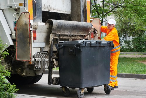 Experienced house clearers sorting belongings for donation and recycling