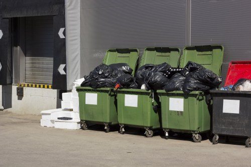 Employees sorting recyclable waste at a Victoria recycling center